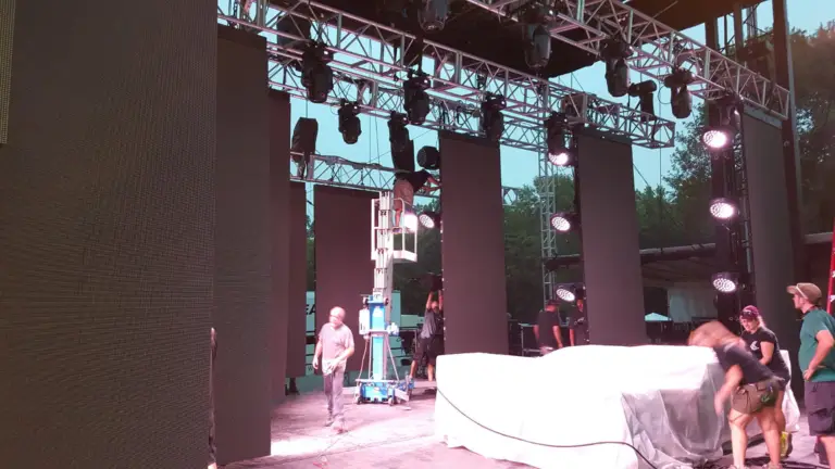 Custom vertical modular LED panels integrated into a stage design for a live event production.