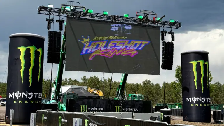 Modular LED Wall rental installed for a live outdoor motosports event with large-format video display, stage rigging, and sponsor branding.
