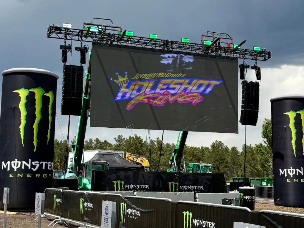 Modular LED wall rental installed for a live outdoor motorsports event with large format display, stage rigging, and branding.