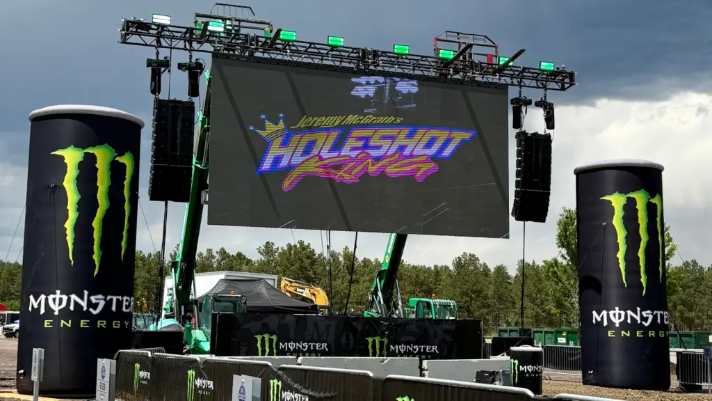 Modular LED wall rental installed for a live outdoor motorsports event with large format display, stage rigging, and branding.