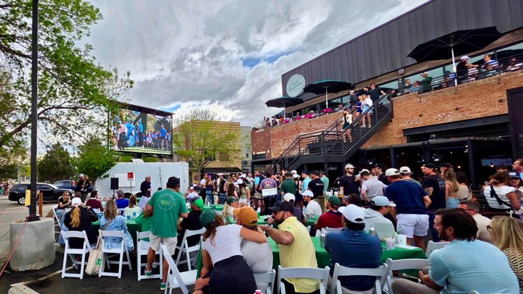 Mobile LED trailer rental broadcasting Masters golf tournament coverage for an outdoor viewing party.
