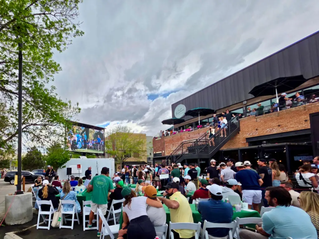 Mobile LED trailer rental broadcasting Masters golf tournament coverage for an outdoor viewing party.