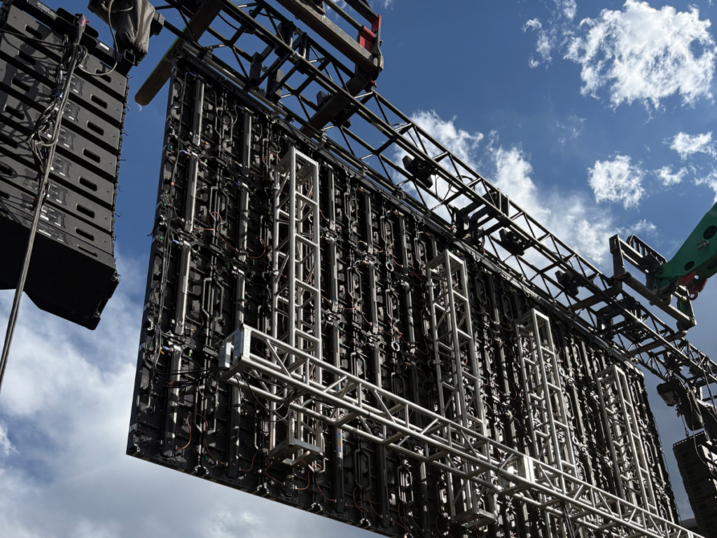 Rear view of modular LED wall panels mounted on event truss rigging